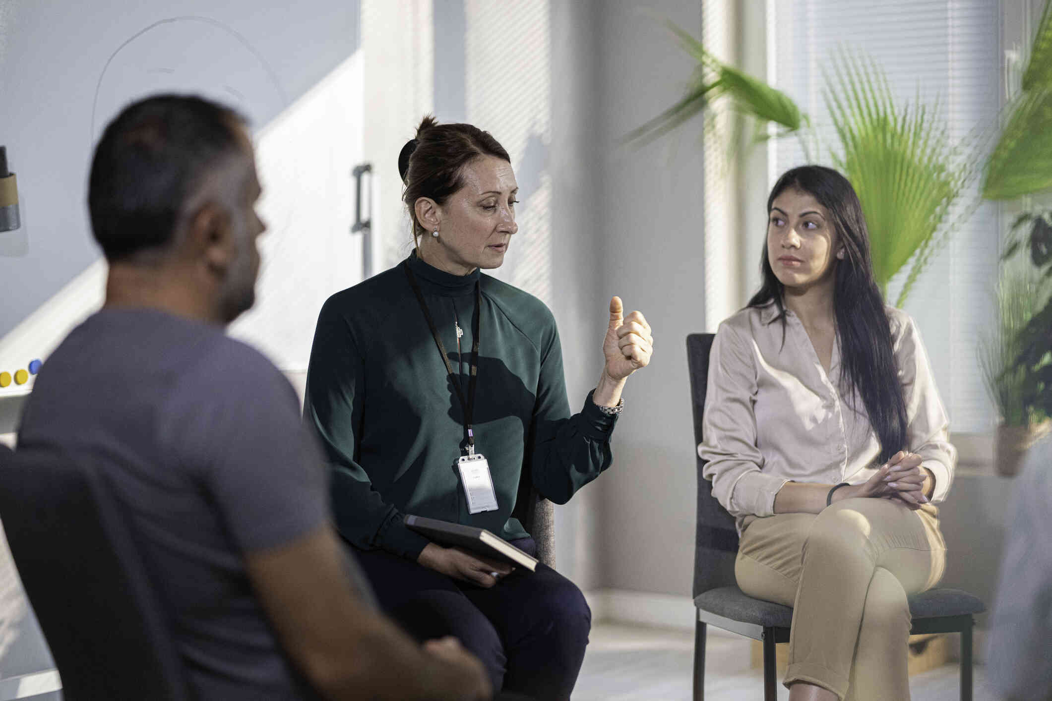 A couple sits together during a therapy session.