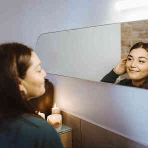  woman looking at mirror