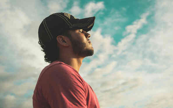 man looking up at sky